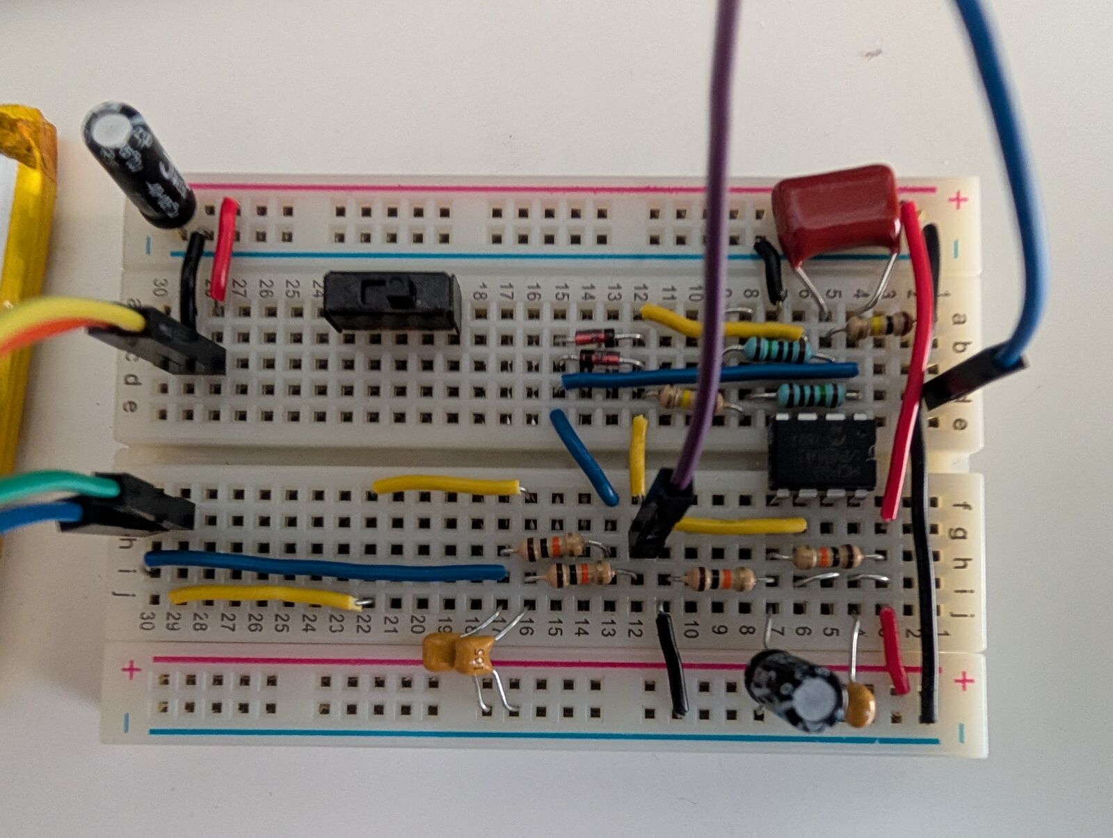 MCP6002 charge-amplifier front end on a half-size breadboard