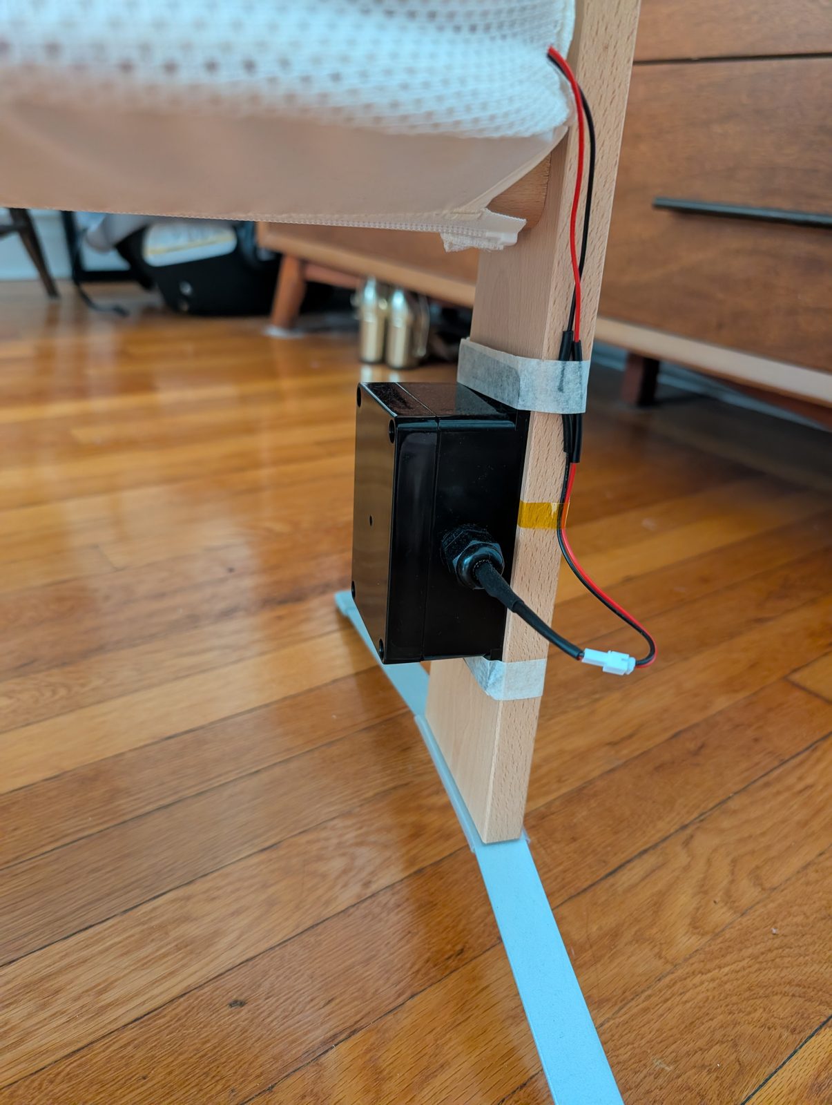 Finished monitor enclosure mounted on the bassinet leg