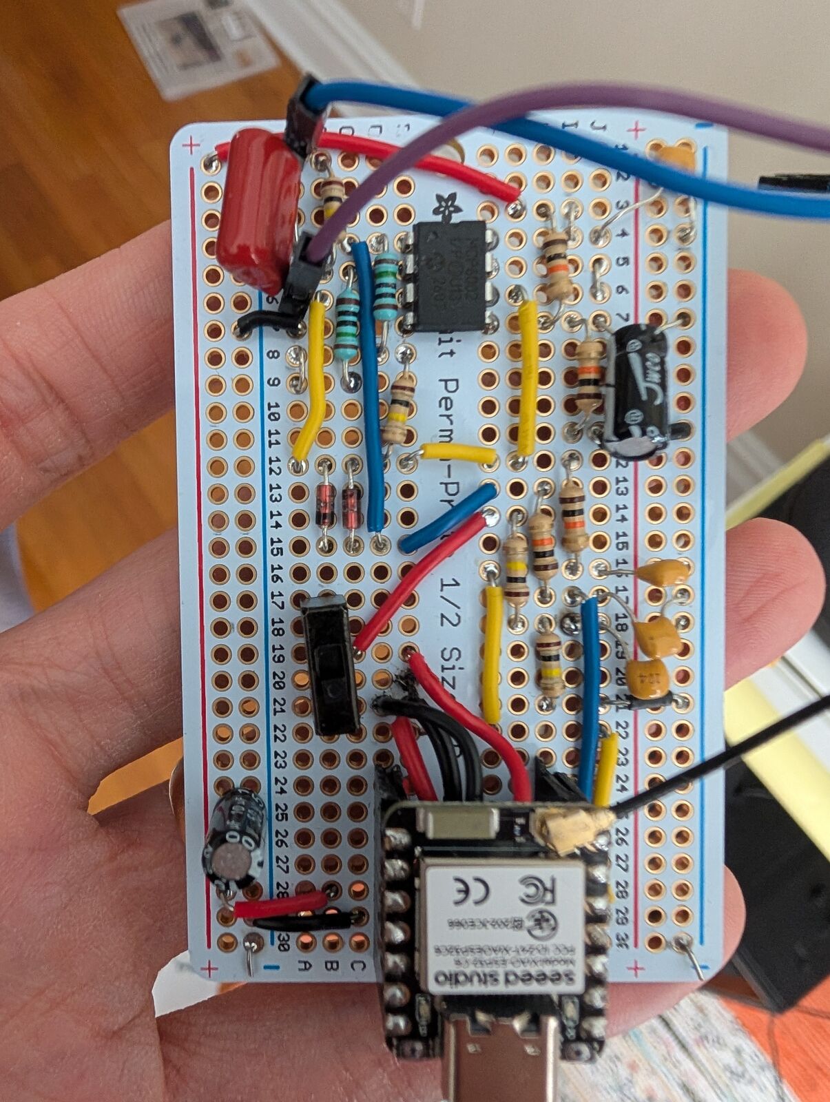 Assembled half-size perma-proto with XIAO ESP32-C6 and MCP6002 front end